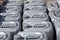 Plastic canisters of grey color in the warehouse