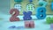 Plastic color numbers Colorful plastic magnetic numbers on color background