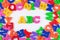 Plastic colored alphabet letters ABC on a white