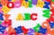 Plastic colored alphabet letters ABC on a white