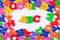 Plastic colored alphabet letters ABC on a white