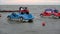 Plastic colorful boats in shape of cars on sea water waves