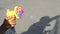 Plastic colorful bubble maker`s gun in young teenage hand in outdoor area