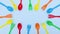 Plastic colorful spoons and forks moving - Plastic spoons and forks frame for text - Stop motion