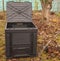 Plastic composter in garden.