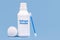 Plastic container, medicine bottle, written in english: hydrogen peroxide, isolated blue background, concept of first care