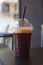 Plastic cup of iced black coffee americano