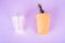 plastic drink cups and paper cup with green twig on very peri background, environmental pollution concept, no plastic