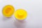 Plastic egg developmental puzzle yellow to form a circle on a white background.