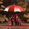 Plastic figures in the form of a family protected by a red umbrella. Insurance concept