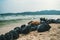 plastic garbage bags full of trash on beach. Garbage collection, cleaning of the nature, garbage collection on the beach