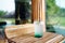 A plastic glass of Iced mojito soda with mint on blurred background.