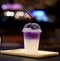 Plastic glass of iced sweet purple potato latte
