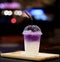 Plastic glass of iced sweet purple potato latte