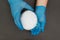 Plastic granules . Polypropylene, polyethylene pellets in hands with gloves. Quality control of plastic in the laboratory in