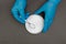 Plastic granules . Polypropylene, polyethylene pellets in hands with gloves. Quality control of plastic in the laboratory in