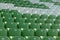 Plastic green and white seats on football stadium