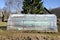 Plastic greenhouse in spring farm garden