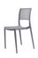 Plastic grey chair with a wicker back. Patio or cafe furniture.