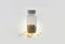 Plastic jar  on a light background. gold stars in a pill jar. plastic jar of star pills