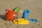 Plastic kids toys on the sand beach
