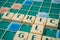 Plastic letters on Scrabble board game forming the word : Ethic