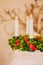 Plastic lingonberry crown with red satin ribbon and white electric lights. Saint Lucias traditional candlelight crown in closeup