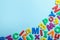 Plastic magnetic letters on color background, top view