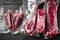 Plastic Market pack with fresh beef steak, tomahawk, t bone, club steak, rib eye and tenderloin cuts, on black wooden table