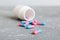 plastic medicine bottle with capsules of pills on colored background. Online pharmacy. Painkiller medicine and