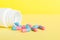 plastic medicine bottle with capsules of pills on colored background. Online pharmacy. Painkiller medicine and