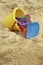 Plastic pail and toys on beach