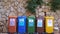 Plastic paper glass metal organic waste sorting. Different Colored Recycle Waste Bins outdoors. Separate waste