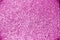 Plastic Pink asphalt texture background, grainy surface.