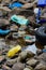 Plastic pollution bottles waste and car tire on ocean beach. Environment damage