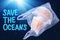 Plastic pollution in ocean environmental problem concept.  jellyfish swim inside plastic bag floating in the ocean