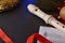 Plastic recorder on black table with Christmas decoration elevated view