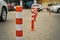 Plastic restricting bollards on the parking area near supermarket