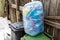 Plastic sack filled with blue plastic mineral water bottles