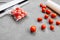 Plastic sealing machine. Vacuum packaging of fresh tomatoes. Flat lay