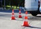 plastic signaling traffic cone encloses a place in the parking lot for trucks