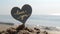 Plastic stick shape of heart with words Love you sand beach sea shore background