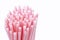 Plastic straws in a bunch isolated on a white background.  Plastic waste concept