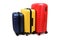 Plastic suitcases of different sizes and colors on wheels are arranged in a row