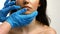 Plastic surgeon touching woman face