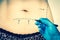 Plastic surgery doctor draw lines on patient belly - retro style