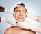 Plastic surgery, scared and face of woman with hands from doctors  on blue background. Skincare, check and