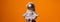 Plastic toy astronaut on colorful orange background Copy space. Concept of out of earth travel, private spaceman