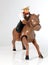 Plastic toy cowboy on galloping horse