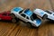 Plastic toys representing a car collision. 3 car pile up, crash, damage, insurance claim, injury, drunk driving